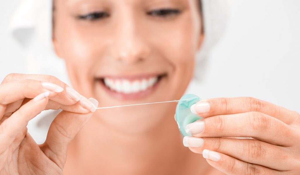 the 4 top benefits of flossing and how to do it